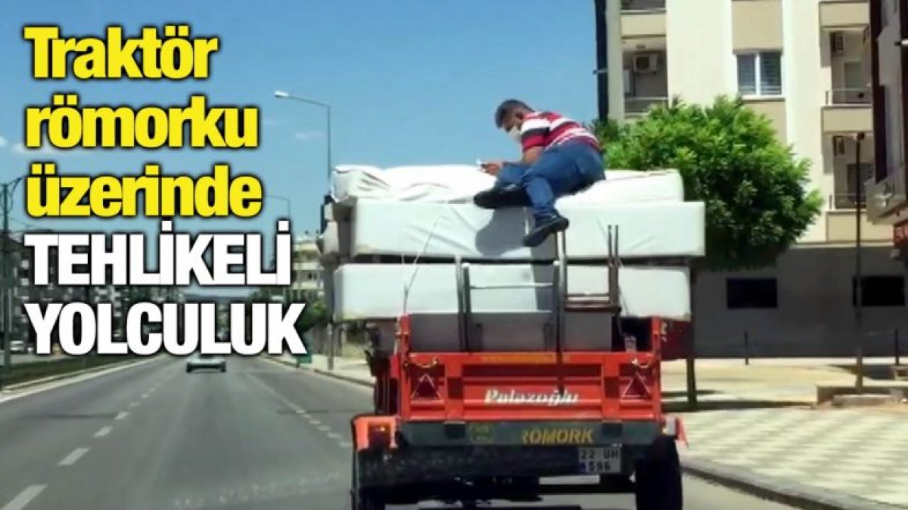 Traktör römorku üzerinde tehlikeli yolculuk