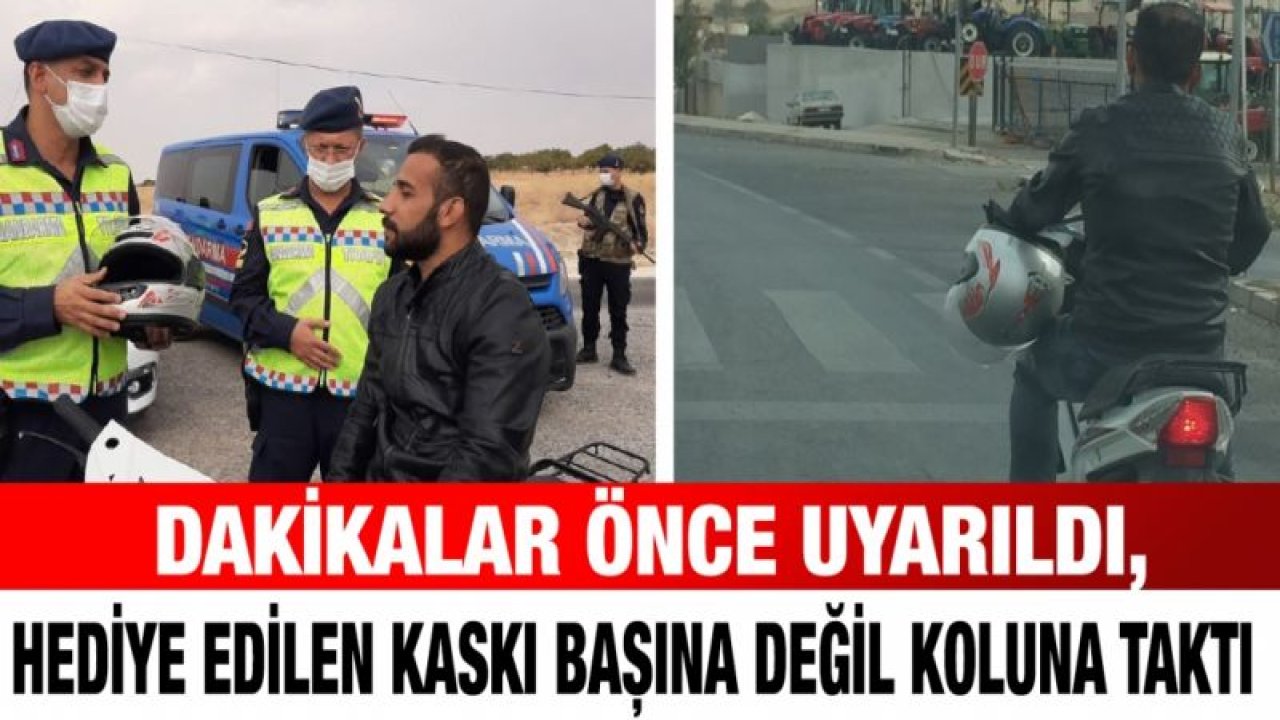 Dakikalar önce uyarıldı, hediye edilen kaskı başına değil koluna taktı